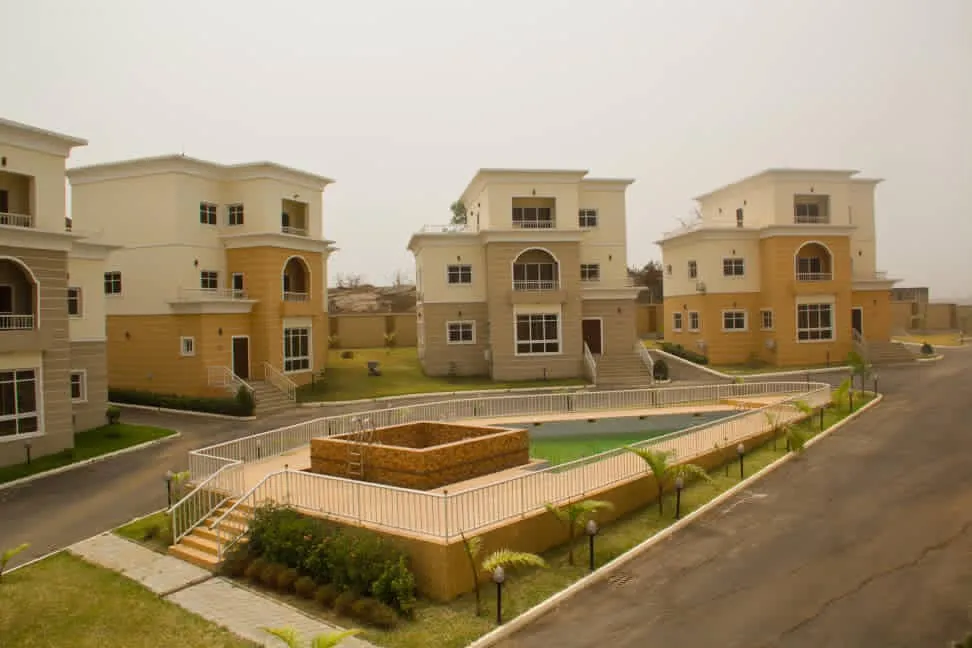 Completed Mindfire estate: detached villas around a central courtyard and pool